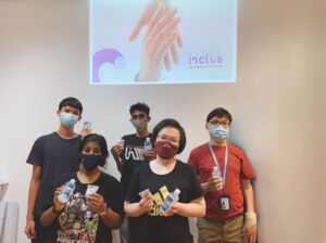5 Inclus trainees posing for a picture.